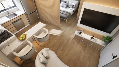 Studio decorado com cama, poltrona e TV